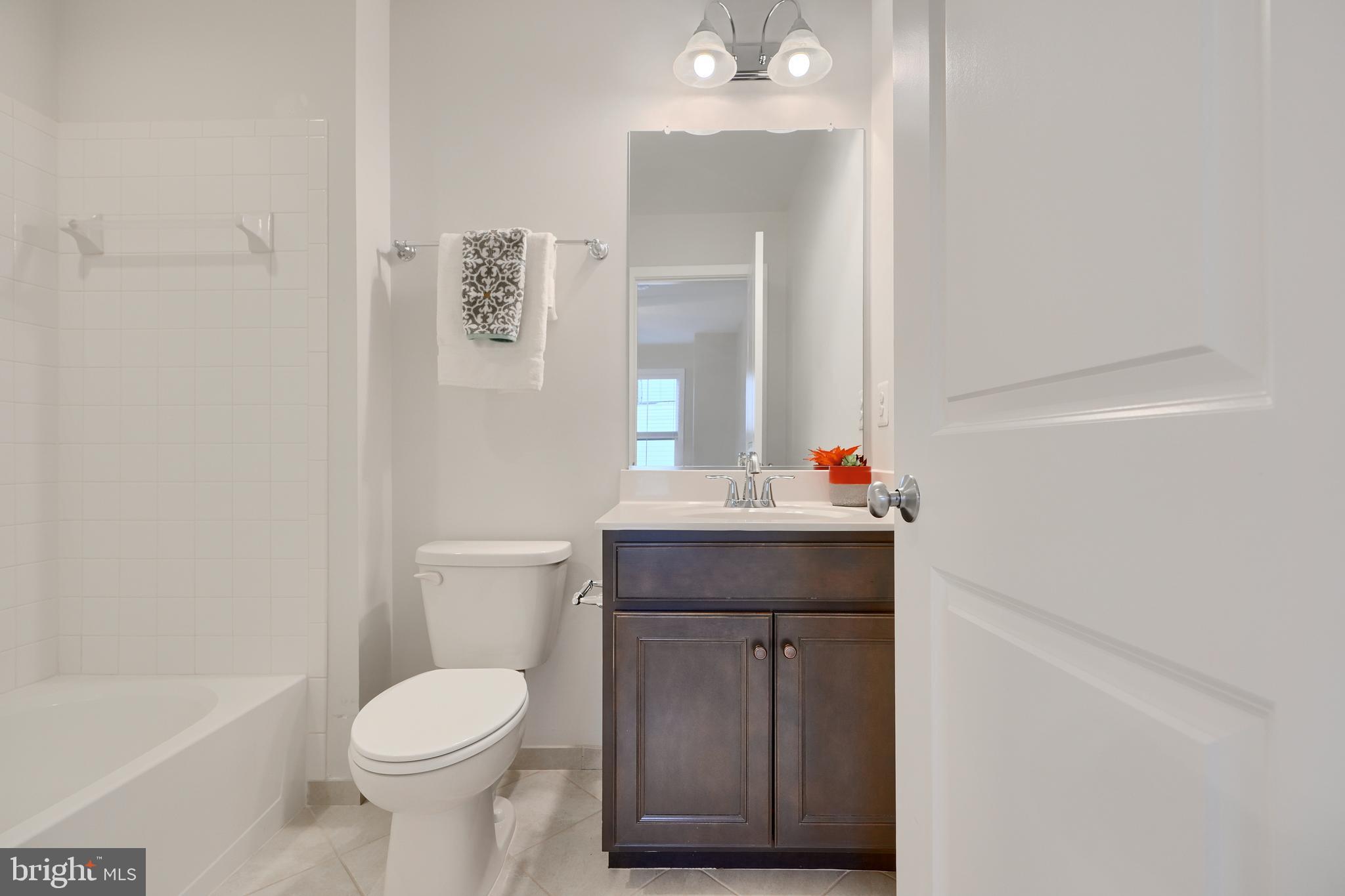 2411 Auden Drive Silver Spring, MD 20906 - Photo 39 of 45 a bathroom with a sink a toilet and shower