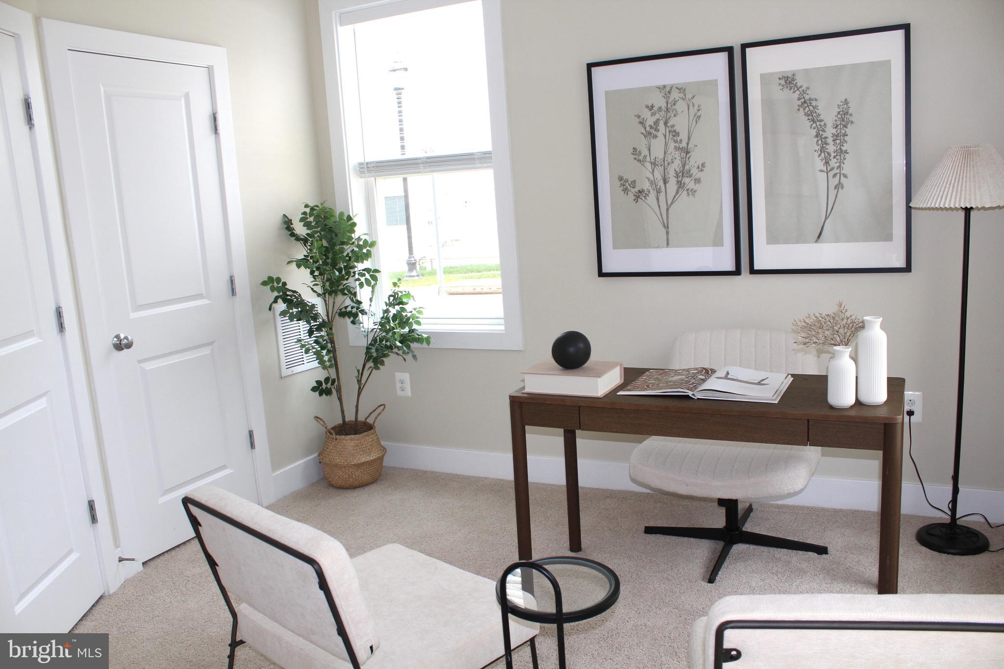 2411 Auden Drive Silver Spring, MD 20906 - Photo 7 of 45 a view of a workspace with furniture and a potted plant