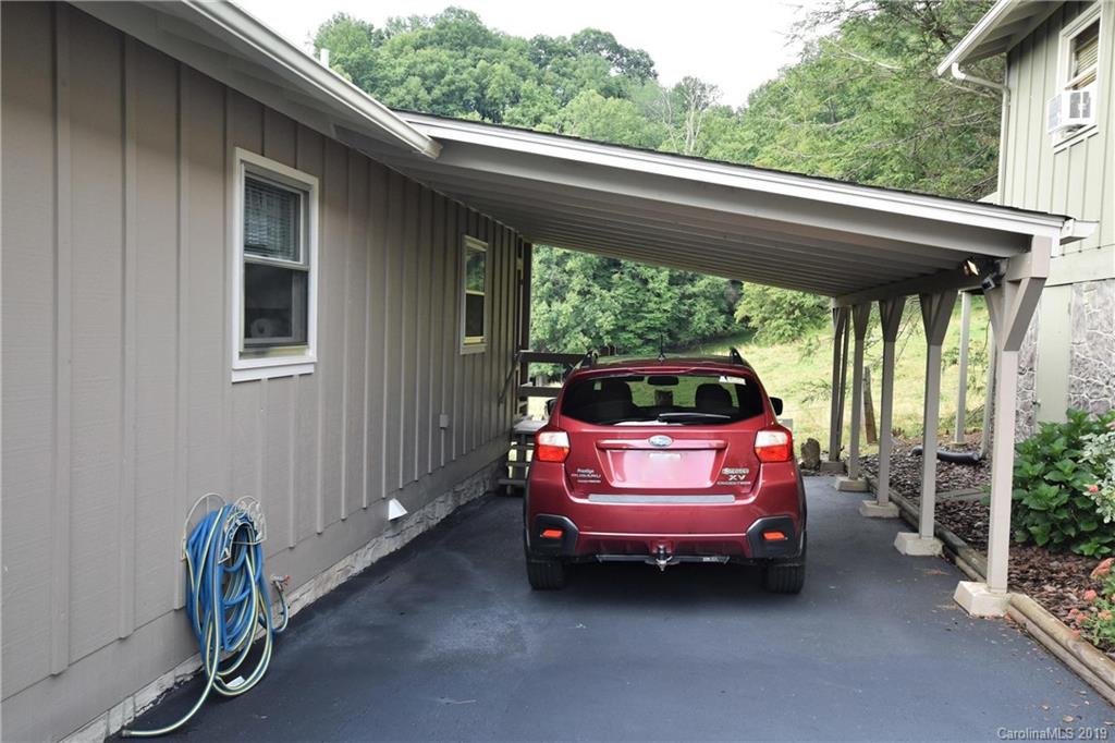 318 Stoney Ridge Loop Maggie Valley, NC 28751 - Photo 22 of 25 a car parked in front of a house