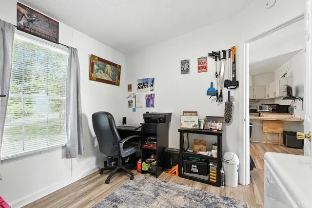 a bedroom with furniture and a window