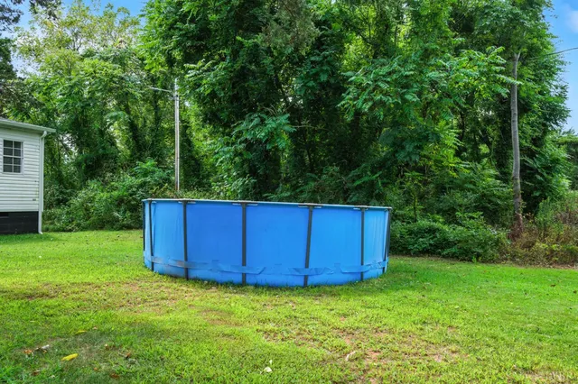 a view of a backyard with sitting area