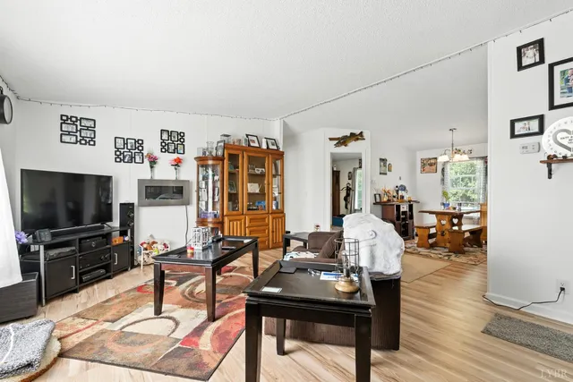 a room with furniture and a flat screen tv