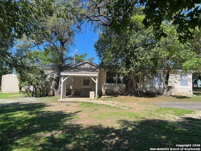 a view of a house with a yard