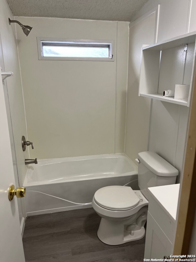 446 Whartons Dock Road Bandera, TX 78003 - Photo 4 of 7 a bathroom with a toilet and a bath tub