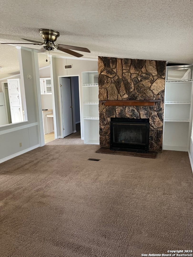 446 Whartons Dock Road Bandera, TX 78003 - Photo 6 of 7 a view of empty room with a fireplace