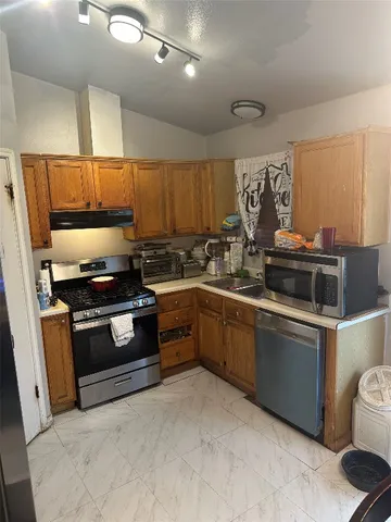 a kitchen with a stove and a sink