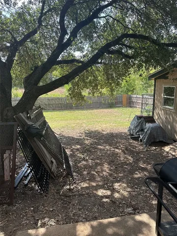 a view of a backyard of the house