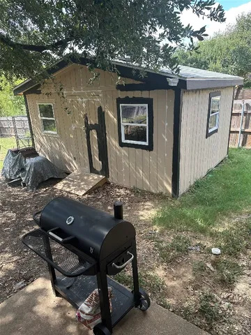 a view of backyard with a table and chair