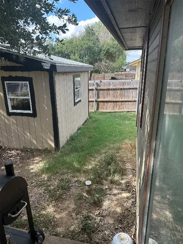 a backyard of a house with lots of green space