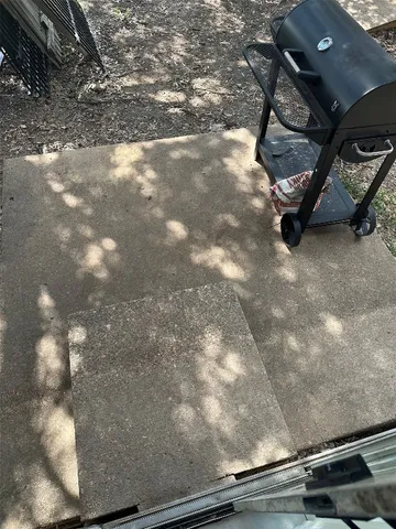 a view of a backyard with sitting area