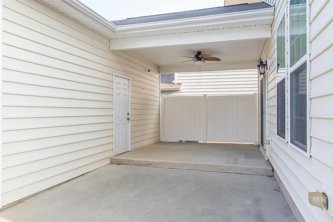 1100 Ileagnes Road Raleigh, NC 27603 - Photo 21 of 22 Situated just off the dining room, the patio is both spacious and fenced. Partially covered, this area is perfect for entertaining regardless of the weather! Patio/Deck