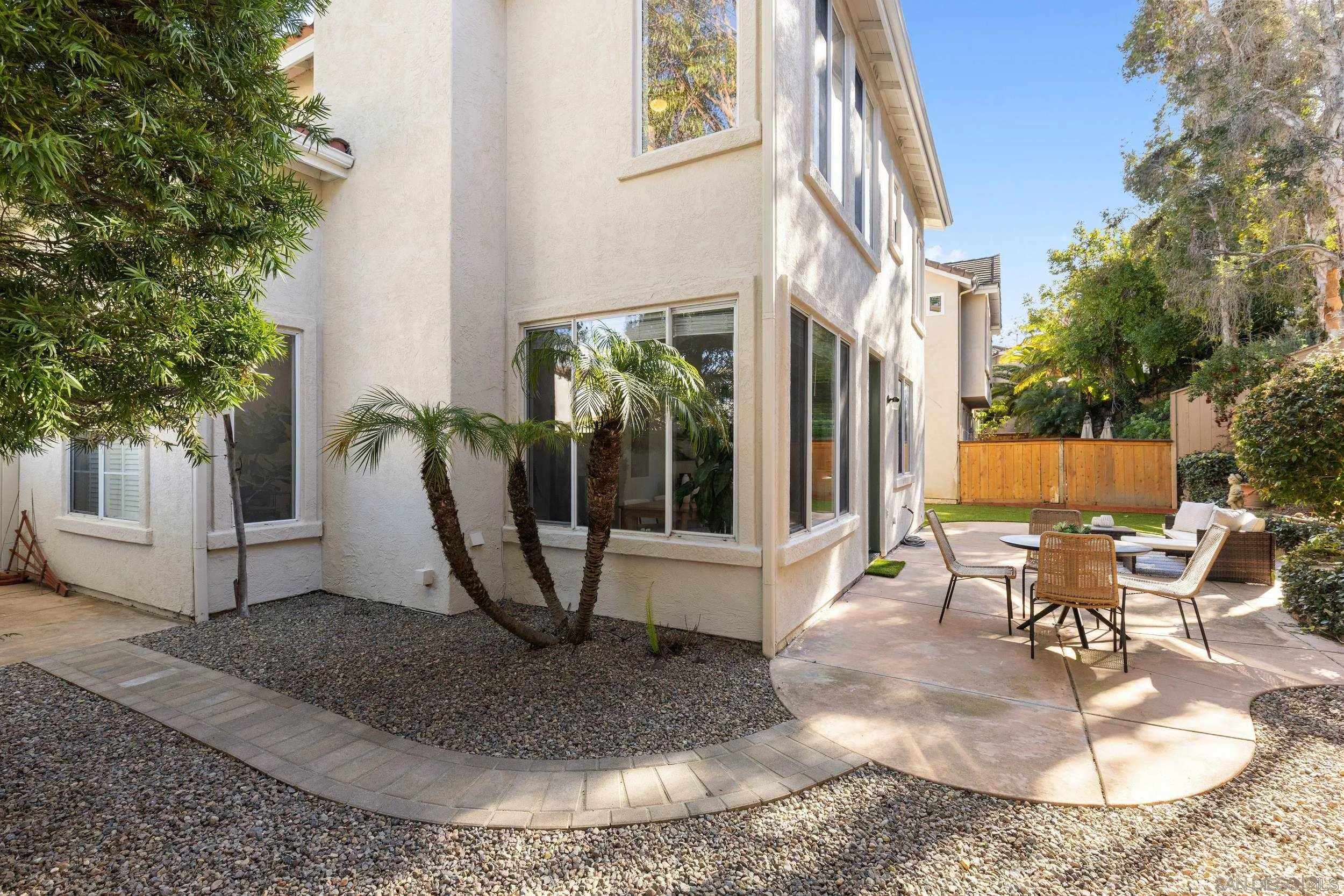 1126 Pacifica Place Encinitas, CA 92024 - Photo 16 of 18 a view of a house with backyard and sitting area
