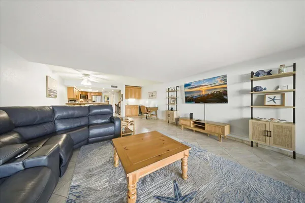 a view of a kitchen with furniture and staircase