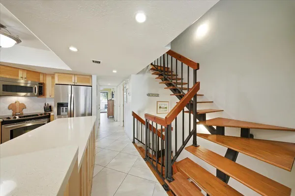 a spacious bedroom with a bed and large window