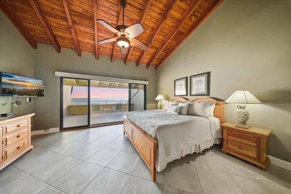 a roof deck with a table and chairs