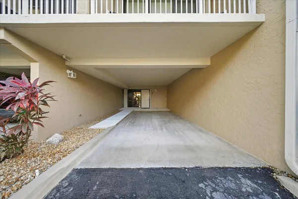 an aerial view of a house with a yard and lake view