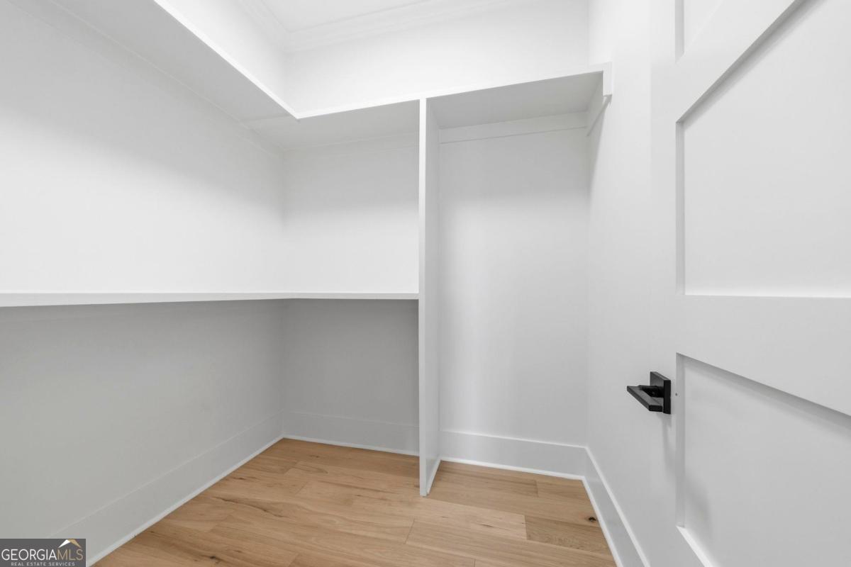 141 Grimes Road Northeast Milledgeville, GA 31061 - Photo 33 of 74 a view of an empty walk in closet