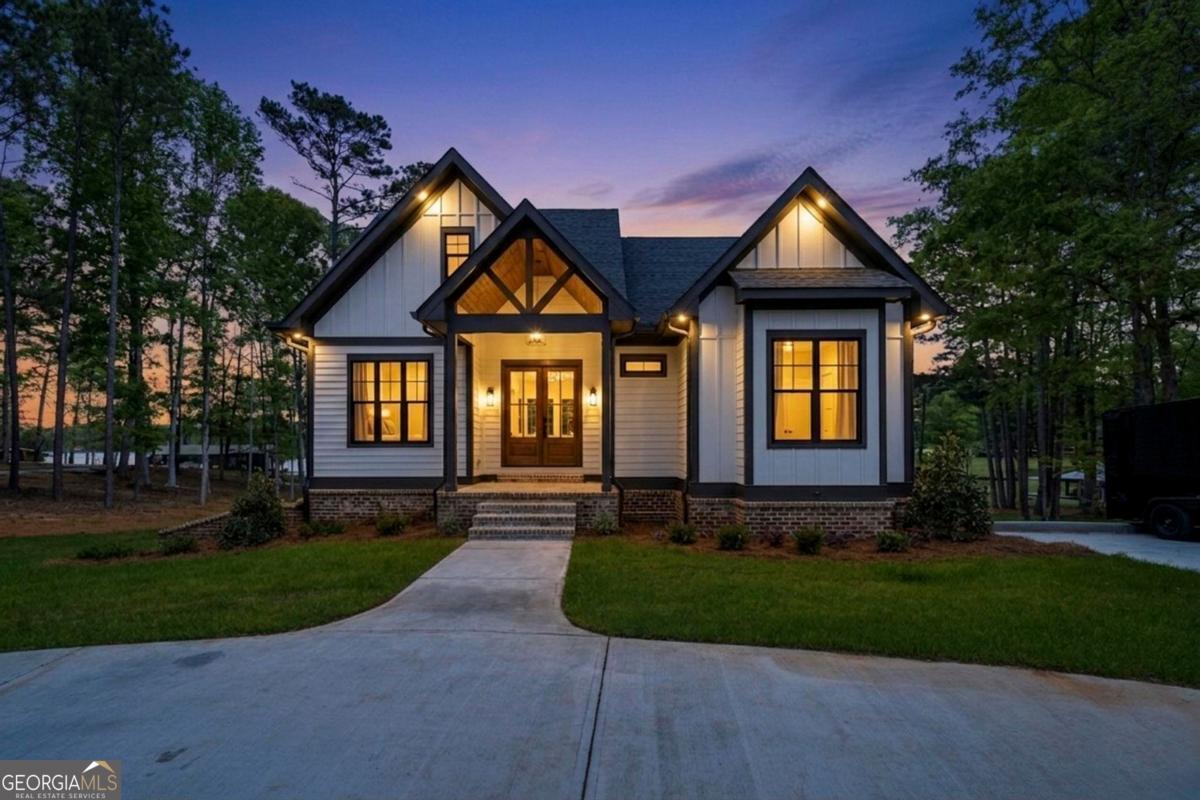 141 Grimes Road Northeast Milledgeville, GA 31061 - Photo 4 of 74 a front view of a house with a yard