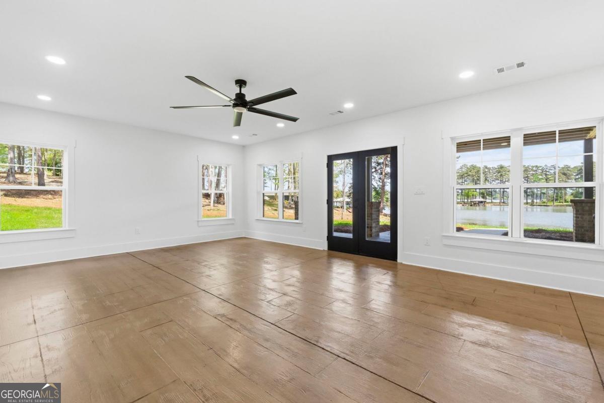 141 Grimes Road Northeast Milledgeville, GA 31061 - Photo 42 of 74 a view of an empty room with a window and a kitchen
