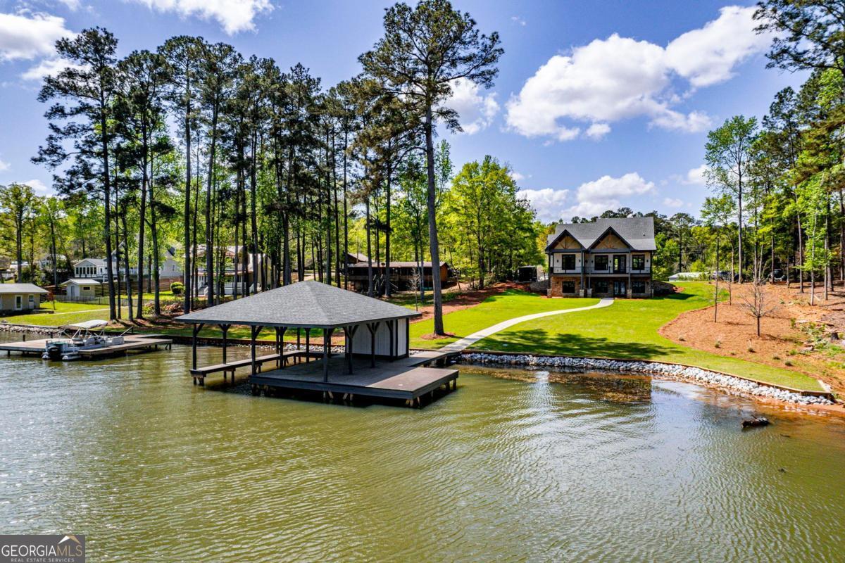 141 Grimes Road Northeast Milledgeville, GA 31061 - Photo 60 of 74 an aerial view of a swimming pool with lounge chair