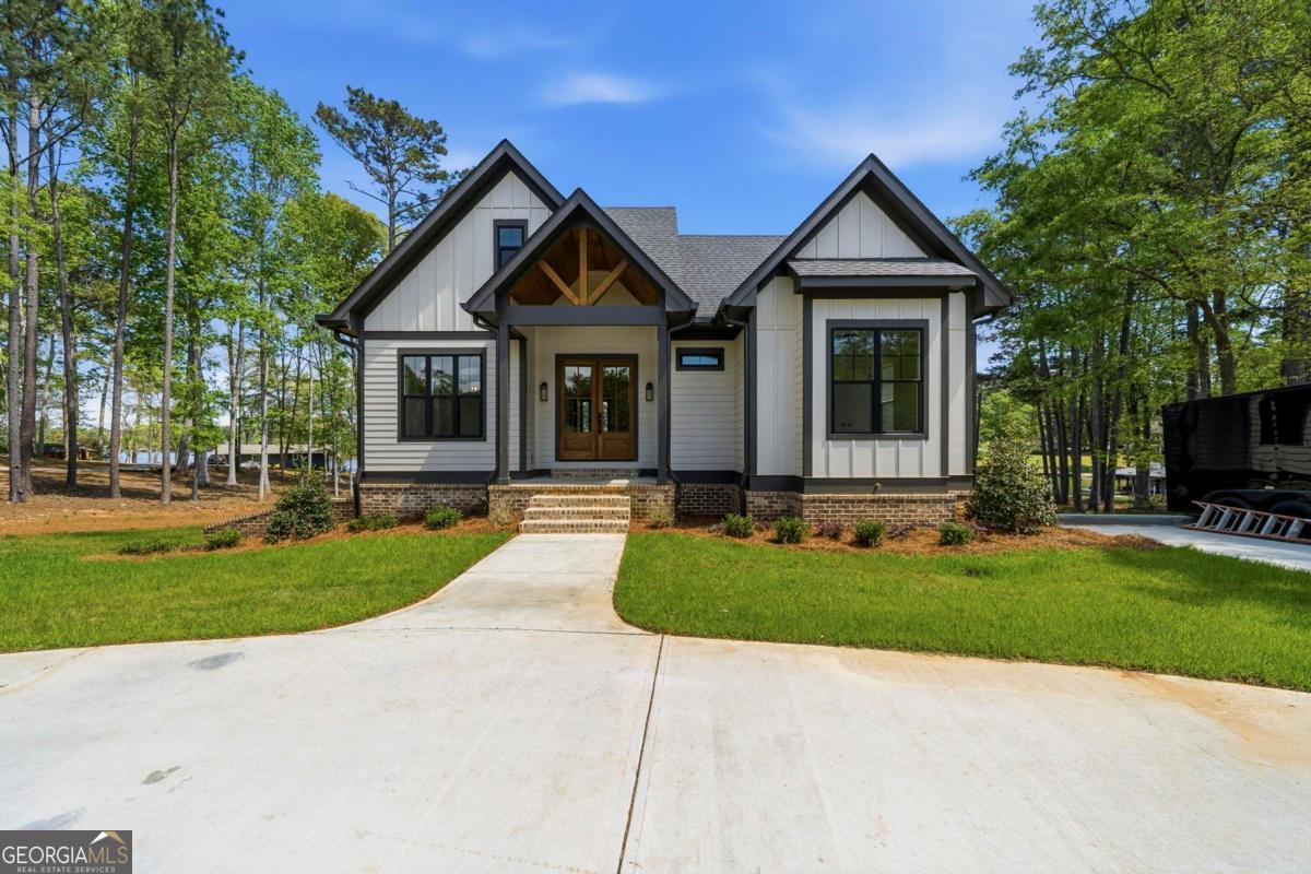 141 Grimes Road Northeast Milledgeville, GA 31061 - Photo 62 of 74 a front view of a house with a yard