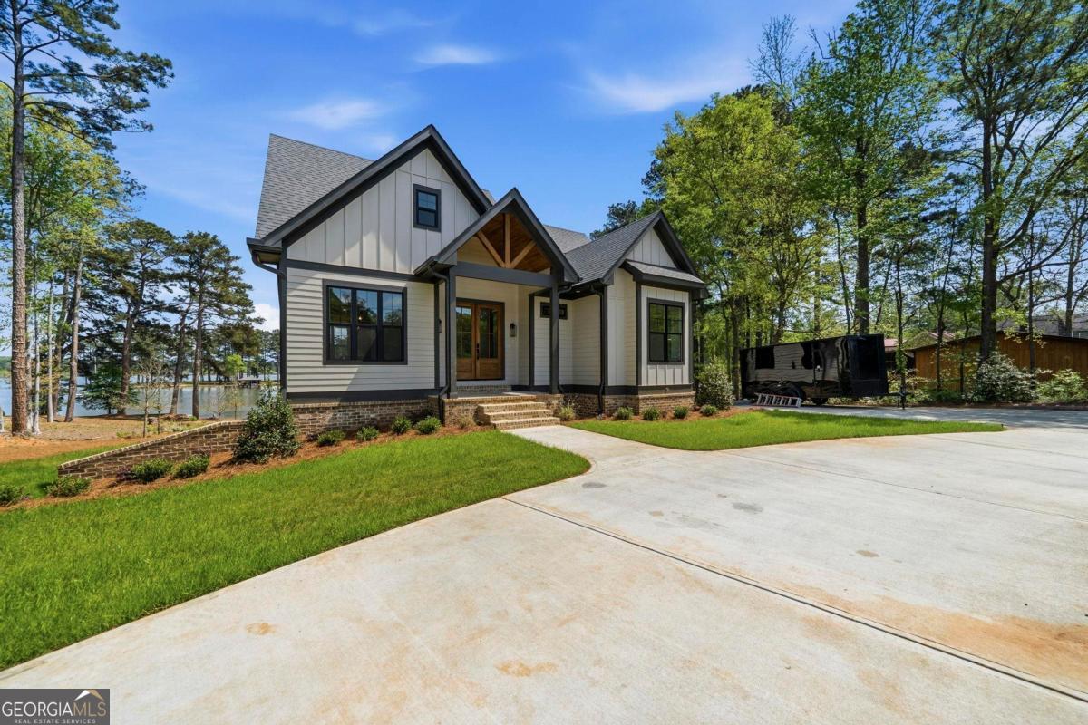 141 Grimes Road Northeast Milledgeville, GA 31061 - Photo 63 of 74 front view of a house with a yard