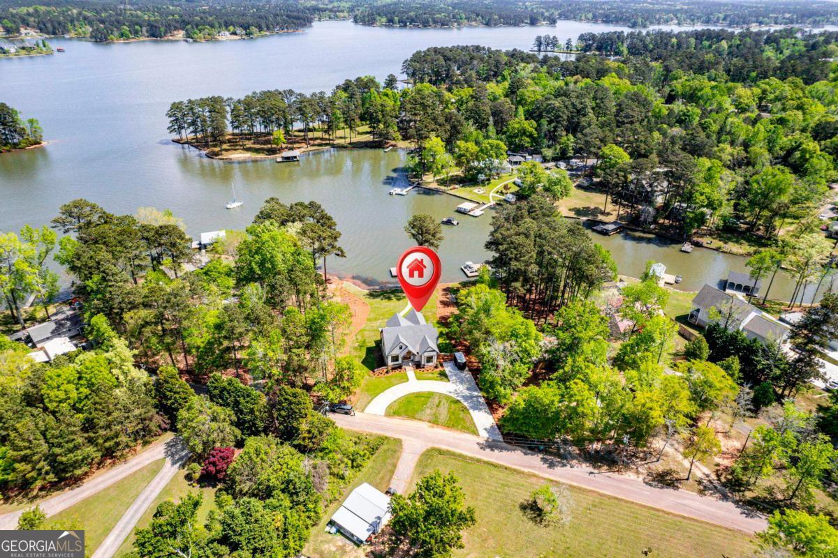 141 Grimes Road Northeast Milledgeville, GA 31061 - Photo 66 of 74 an aerial view of residential house with outdoor space and lake view