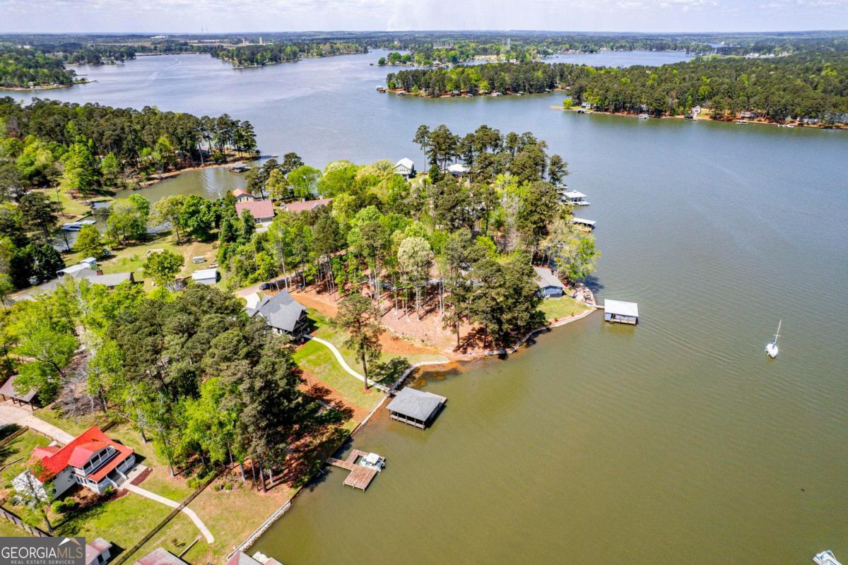 141 Grimes Road Northeast Milledgeville, GA 31061 - Photo 68 of 74 an aerial view of a house with a lake view