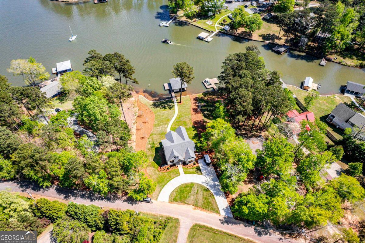 141 Grimes Road Northeast Milledgeville, GA 31061 - Photo 73 of 74 an aerial view of a house with a yard and lake view