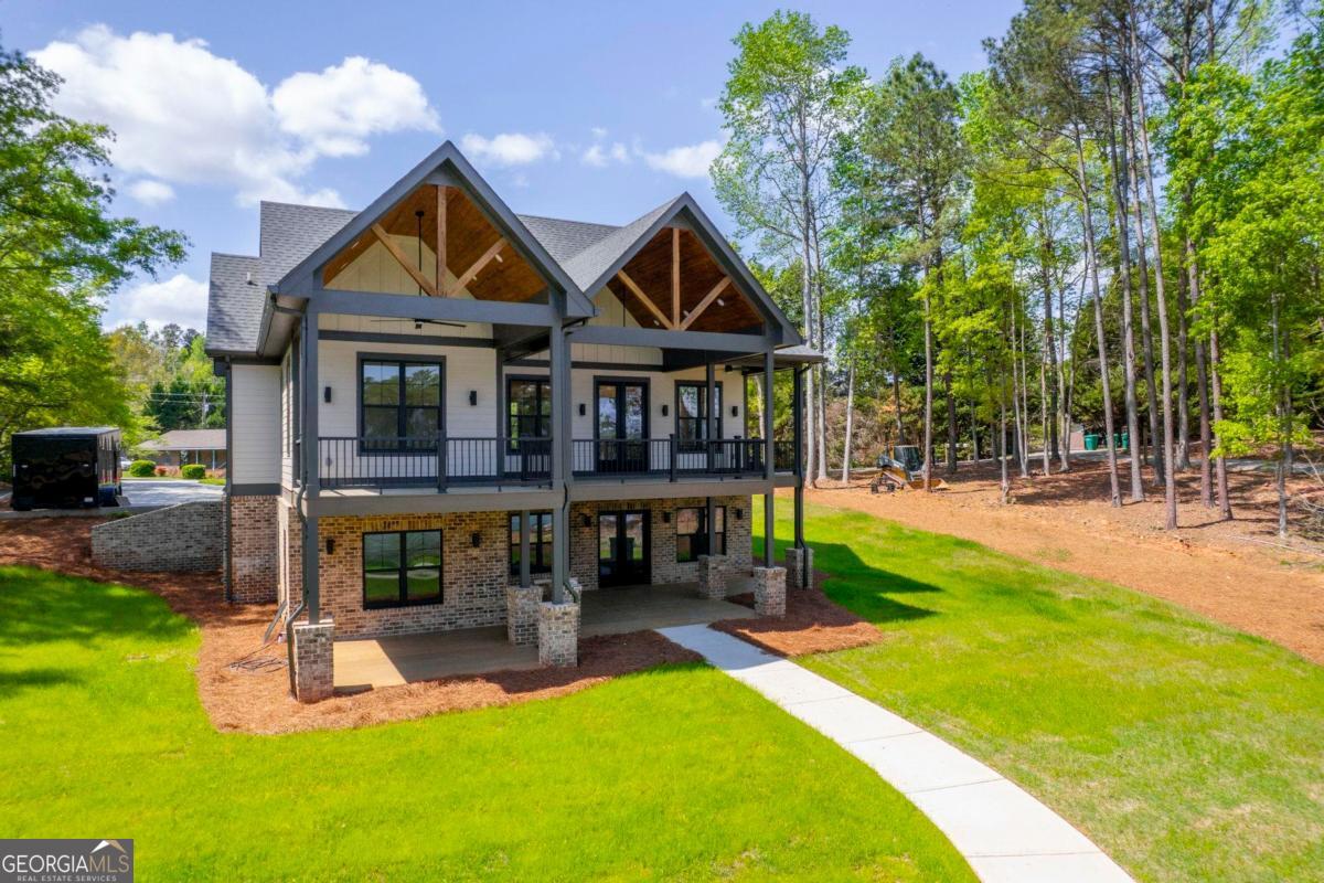 141 Grimes Road Northeast Milledgeville, GA 31061 - Photo 74 of 74 a front view of a house with yard and green space