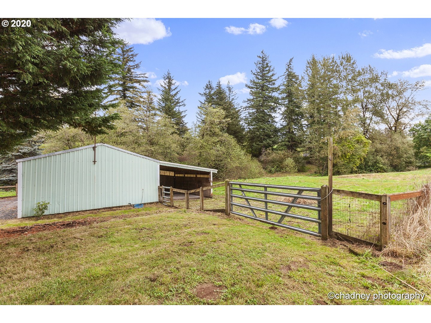 33833 Southeast Hurlburt Road Corbett, OR 97019 - Photo 30 of 32 a view of a backyard with wooden fence and a bench