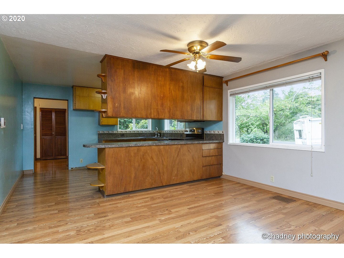 33833 Southeast Hurlburt Road Corbett, OR 97019 - Photo 8 of 32 a kitchen with stainless steel appliances kitchen island granite countertop a stove a sink and a wooden floors