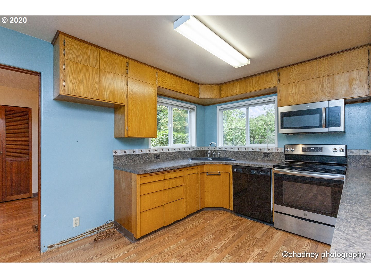 33833 Southeast Hurlburt Road Corbett, OR 97019 - Photo 9 of 32 a kitchen with stainless steel appliances granite countertop a stove a sink and a microwave