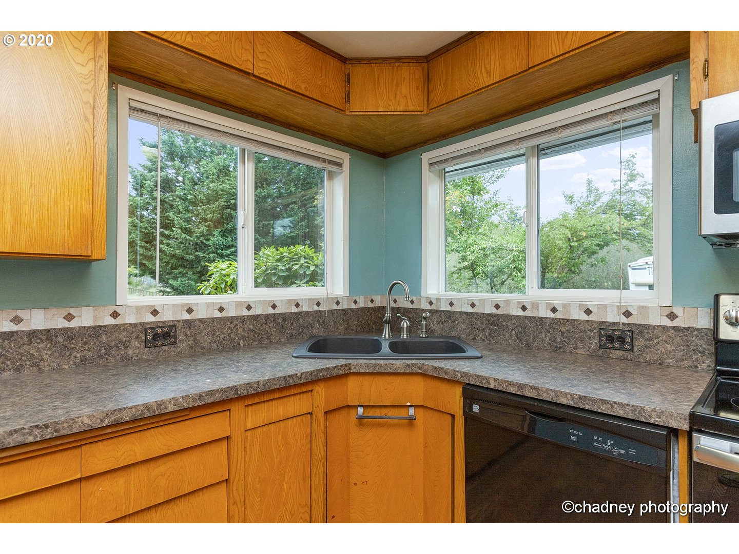 33833 Southeast Hurlburt Road Corbett, OR 97019 - Photo 10 of 32 a kitchen with sink a window and cabinets
