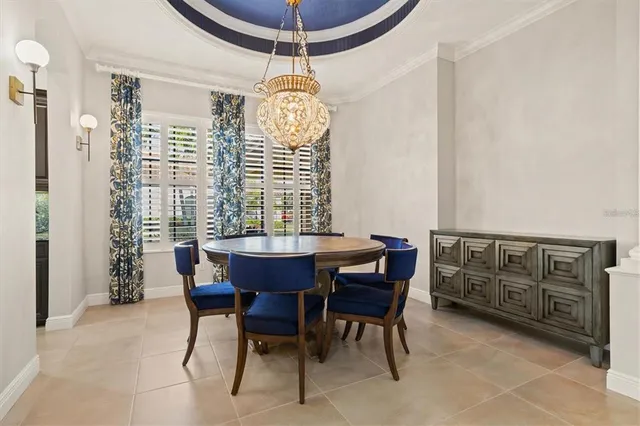 a view of a dining room with furniture window and chandelier