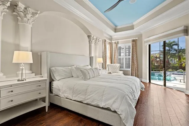 a room with walk in closet and wooden floor