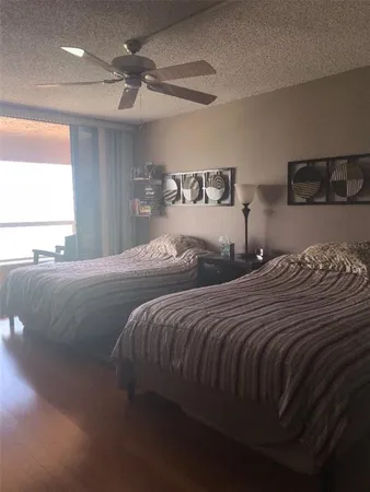 a bedroom with double bed and a window