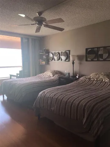 a bedroom with double bed and a window