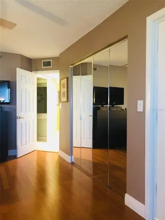 a bathroom with a toilet a sink and a mirror