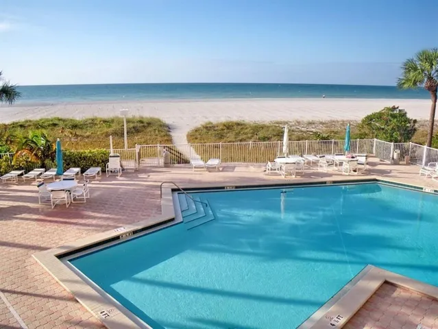 a view of a swimming pool with a patio