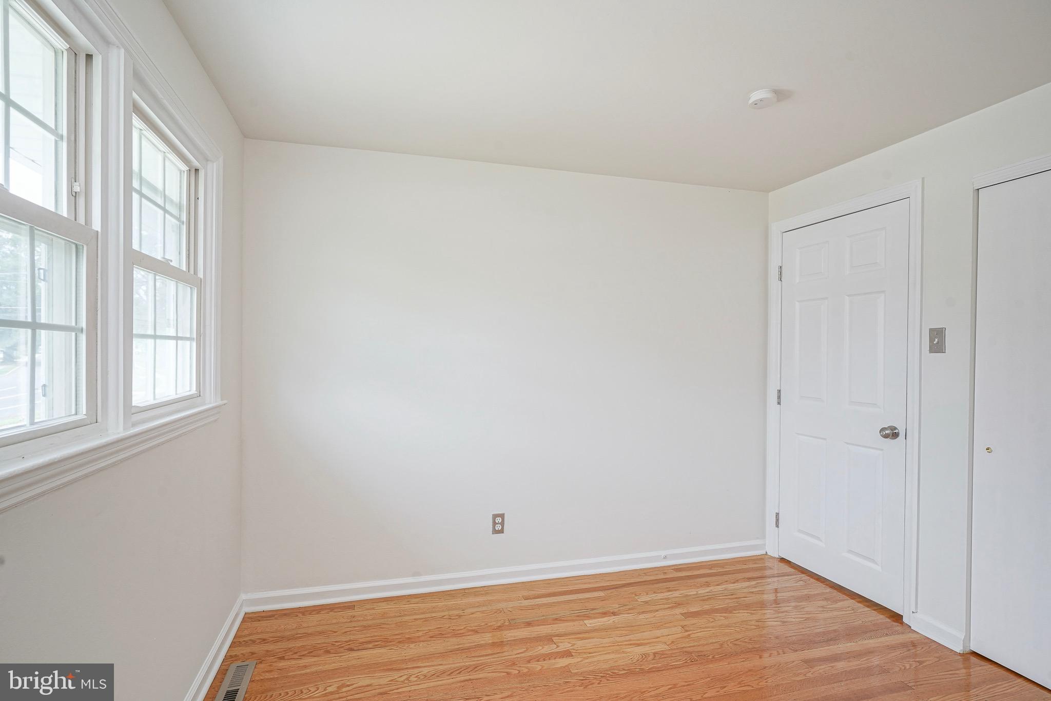 502 Pomona Road Cinnaminson, NJ 08077 - Photo 15 of 34 a view of an empty room with wooden floor and a window