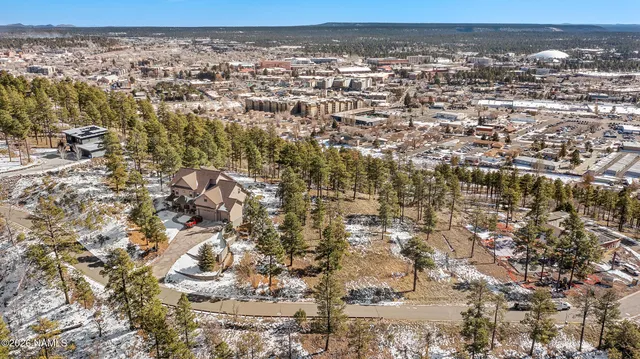 an aerial view of residential building with parking space