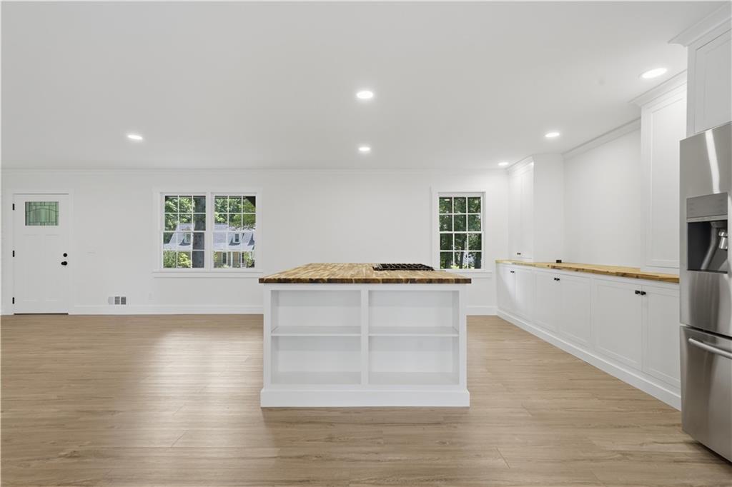 125 Childers Road Canton, GA 30115 - Photo 20 of 48 a view of an empty room with wooden floor and a window