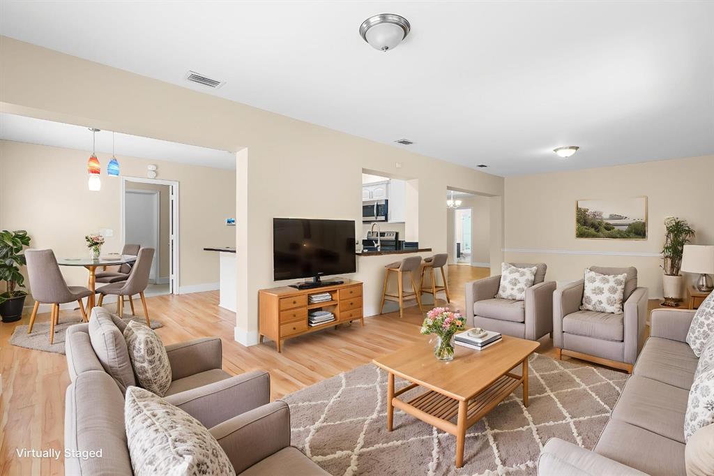 7836 Cloverfield Circle Boca Raton, FL 33433 - Photo 11 of 39 a living room with furniture and a flat screen tv