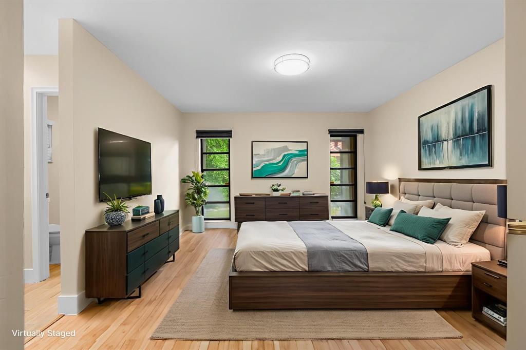 7836 Cloverfield Circle Boca Raton, FL 33433 - Photo 14 of 39 a bedroom with a bed and a flat screen tv