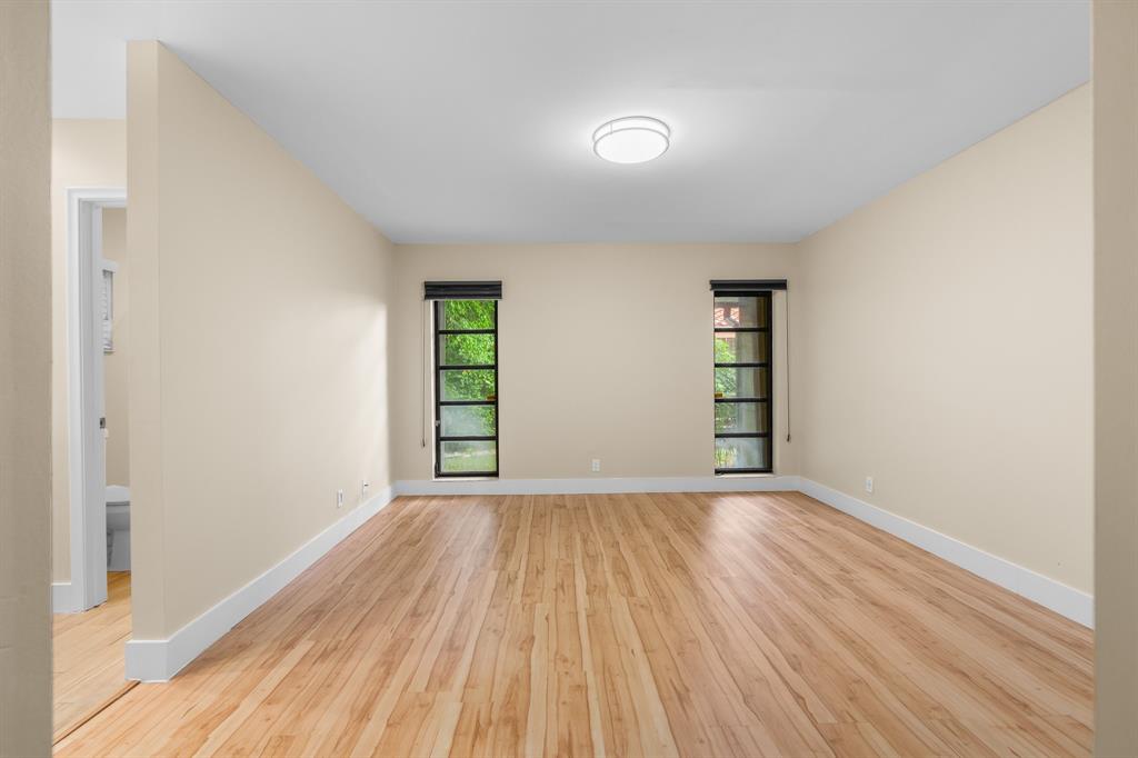 7836 Cloverfield Circle Boca Raton, FL 33433 - Photo 15 of 39 an empty room with wooden floor closet and windows