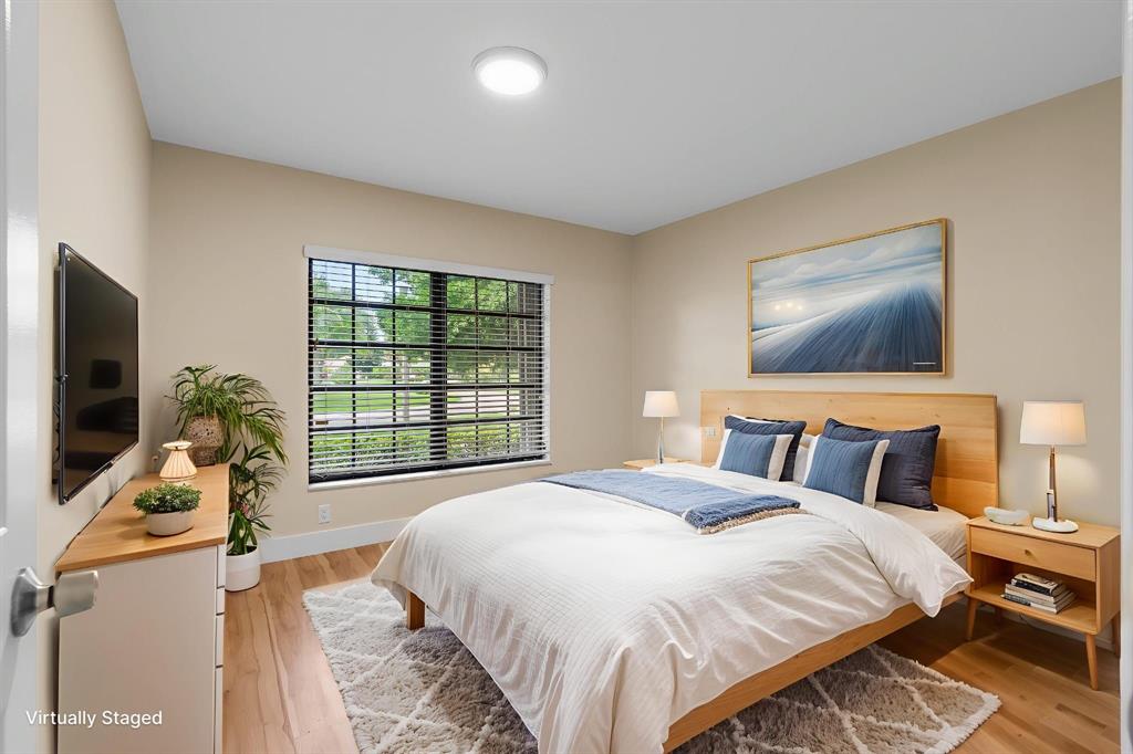 7836 Cloverfield Circle Boca Raton, FL 33433 - Photo 26 of 39 a bedroom with a bed and a flat screen tv