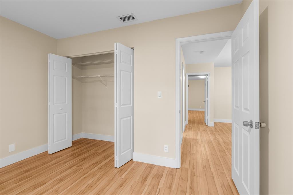 7836 Cloverfield Circle Boca Raton, FL 33433 - Photo 29 of 39 a view of a room with wooden floor and a bathroom