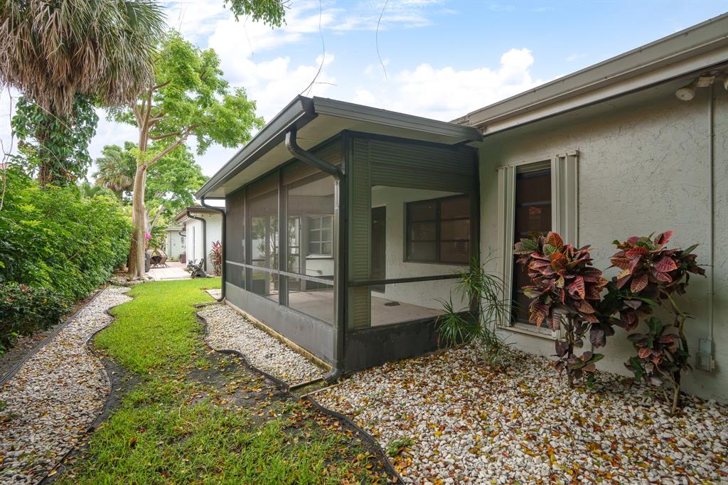 7836 Cloverfield Circle Boca Raton, FL 33433 - Photo 35 of 39 front view of a house with a yard