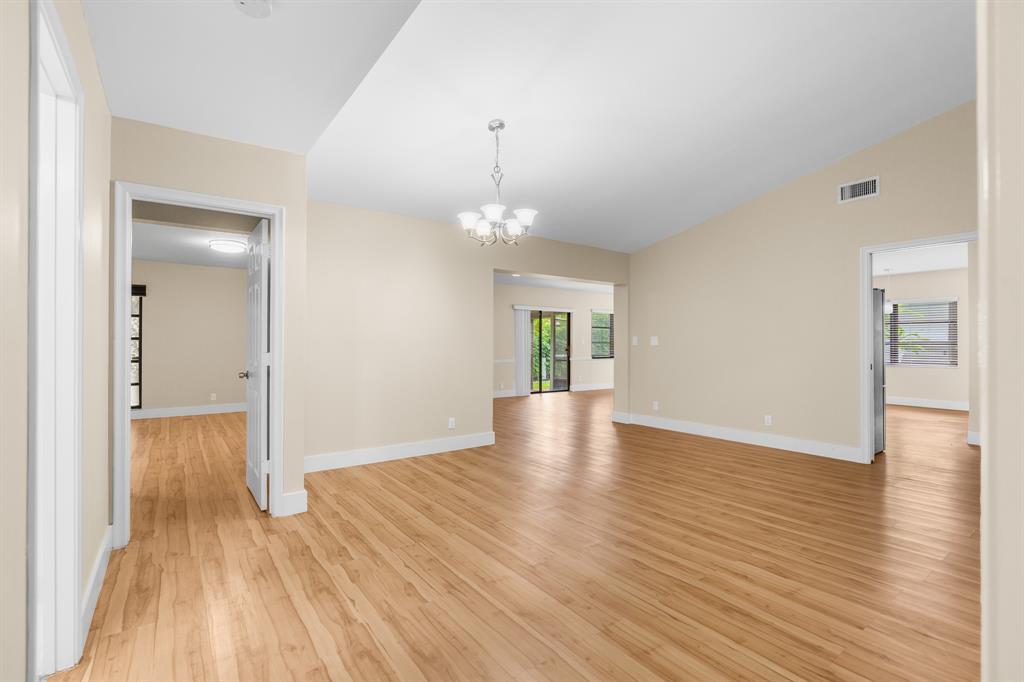 7836 Cloverfield Circle Boca Raton, FL 33433 - Photo 5 of 39 a view of livingroom with hardwood floor and hallway
